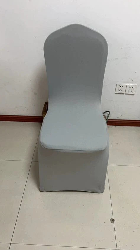 White thickened one-piece hotel wedding banquet chair cover by Showlu Fashion Store, fitted over a banquet chair.