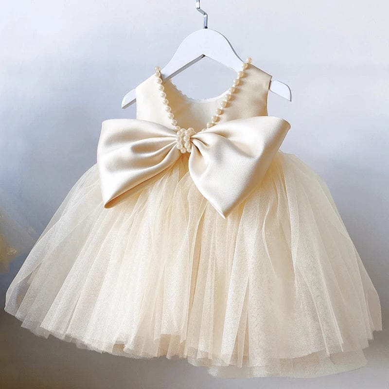 Toddler girl in a SHOWLU FASHION STORE big bow baptism dress, perfect for princess parties, weddings, and special occasions.