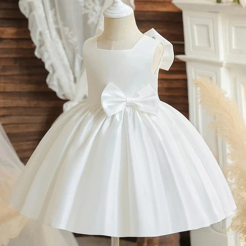 Toddler girl wearing a big bow baptism dress, SHOWLU FASHION STORE princess party gown for girls' birthday or wedding celebration.