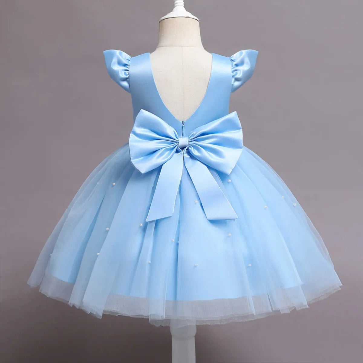 Toddler girl blue beaded tutu gown with V-back and bow, tulle skirt, perfect for birthday parties and special occasions.