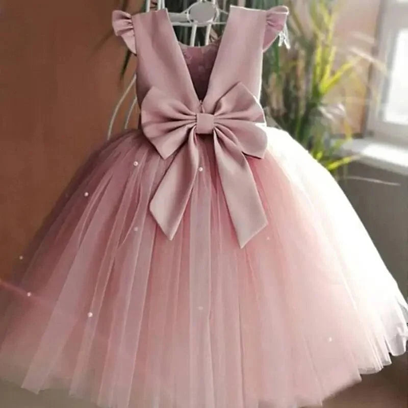 Toddler girl blue beaded tutu gown with v-back, tulle skirt, bow detail, perfect for birthday parties and special occasions.