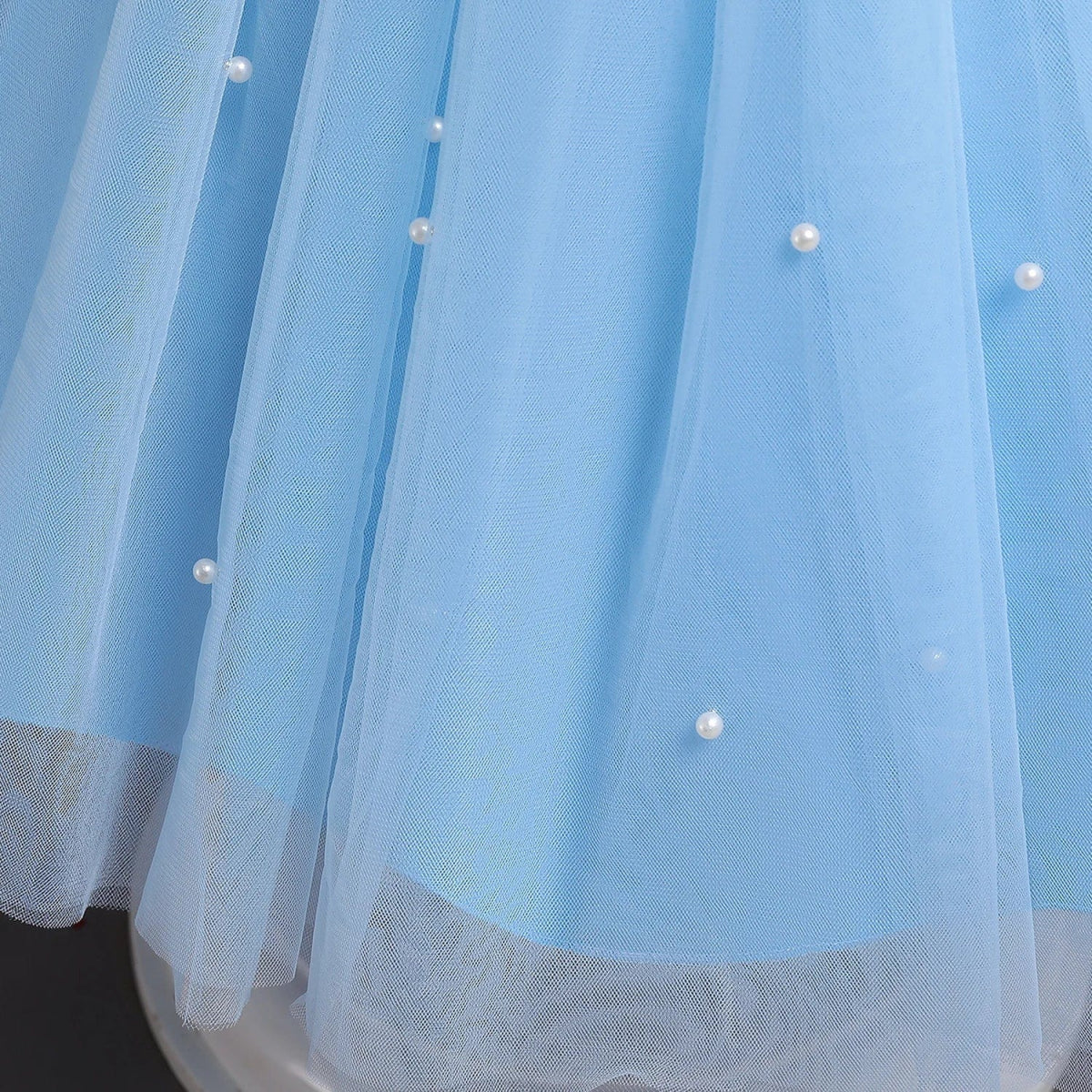 Toddler girl blue beaded tutu gown with V-back and bow, suitable for birthday parties, made of tulle for ages 1-5.
