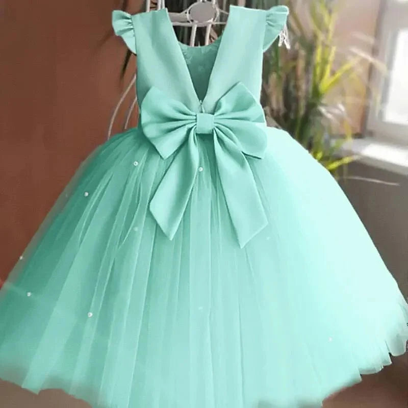 Toddler girl blue beaded tutu gown with v-back and bow, suitable for birthday parties, made of tulle for infant and little girls.