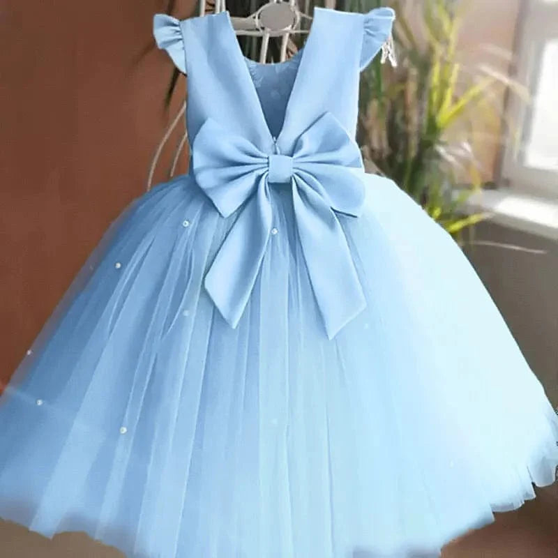 Toddler girl blue beaded tutu gown with V-back and bow, suitable for birthday parties, made of tulle and soft fabric.