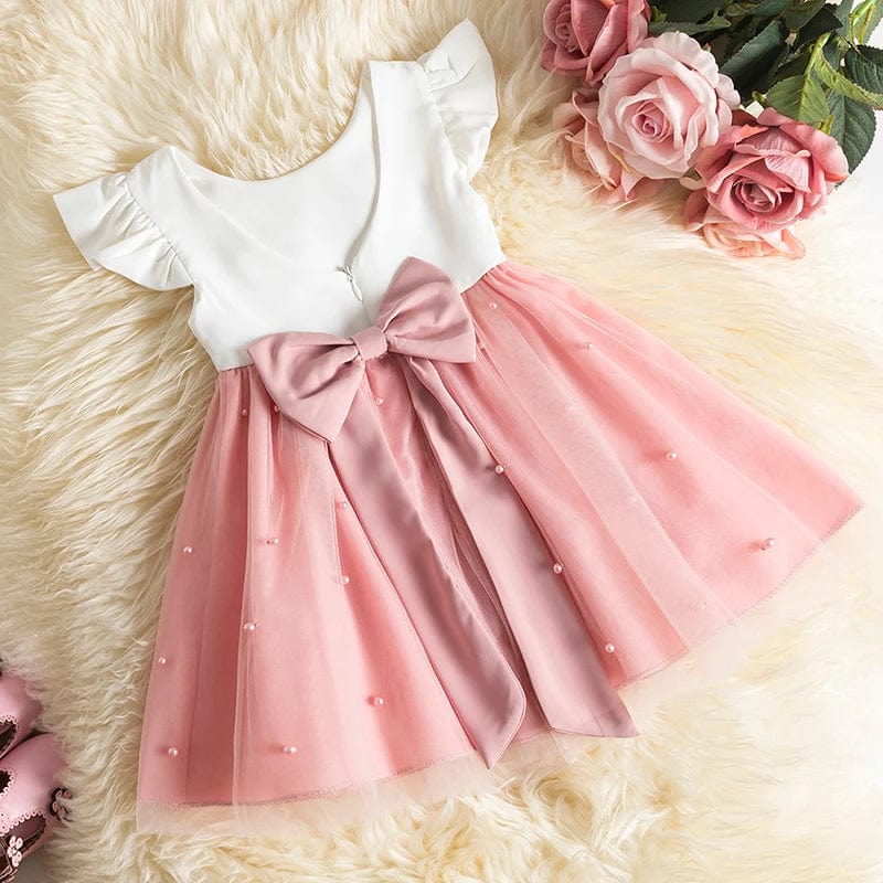 Toddler girl princess ball gown by Showlu Fashion for first communion, sleeveless with elegant floral details for special occasions.