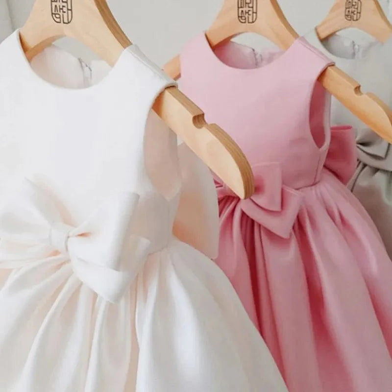 Toddler girl princess ball gown by Showlu Fashion Store, sleeveless elegant dress for first communion, baptism, or special occasions.