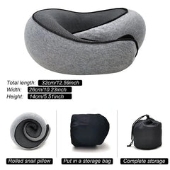A grey memory foam travel neck pillow shown in its full shape and rolled for storage.