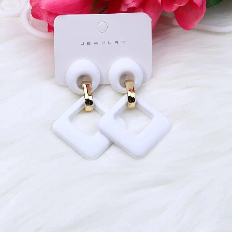 Showlu Fashion Geometric Hollow Square Acrylic Dangle Earrings in blue, white, and pink for women and girls.