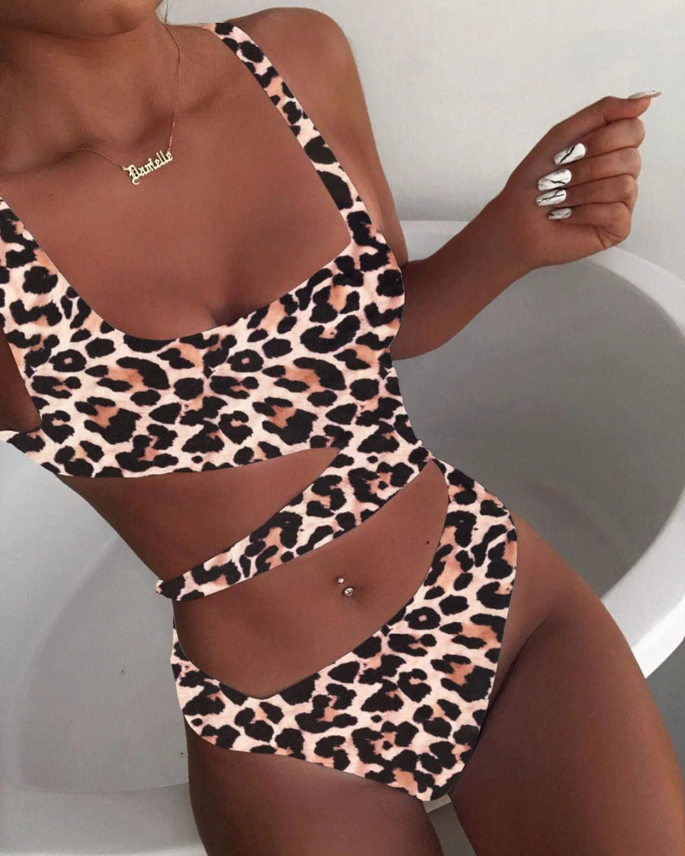 Showlu Fashion Women's hollow-out one-piece swimsuit with triangle nylon chest pad, solid color, spaghetti straps, and sexy midriff design.