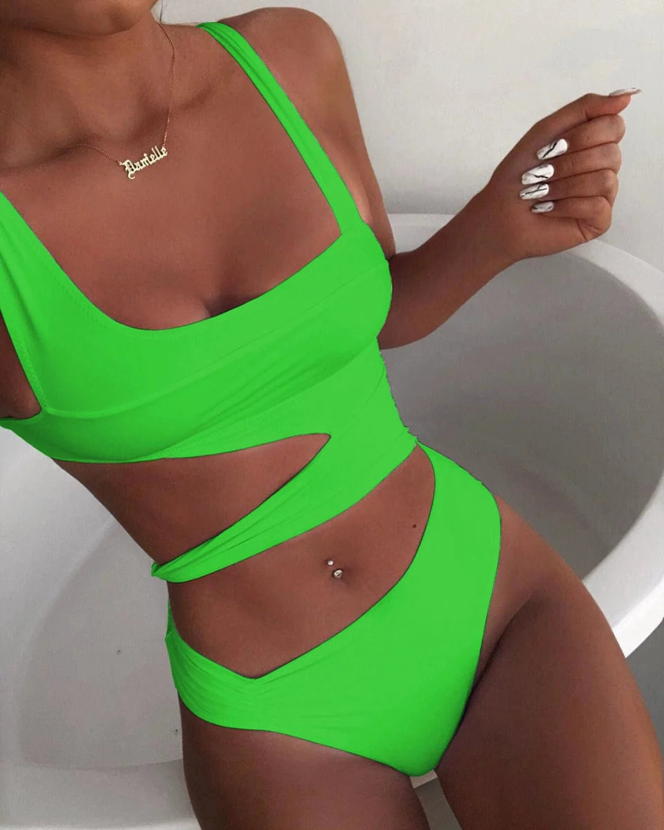 Showlu Fashion Women's hollow-out one-piece swimsuit with triangle nylon chest pad, solid color, spaghetti straps, and sexy midriff design.