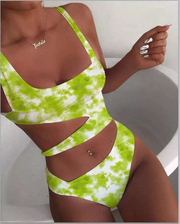 Showlu Fashion Women's hollow-out one-piece swimsuit with nylon triangle chest pad, solid color, spaghetti straps, and stylish midriff design.