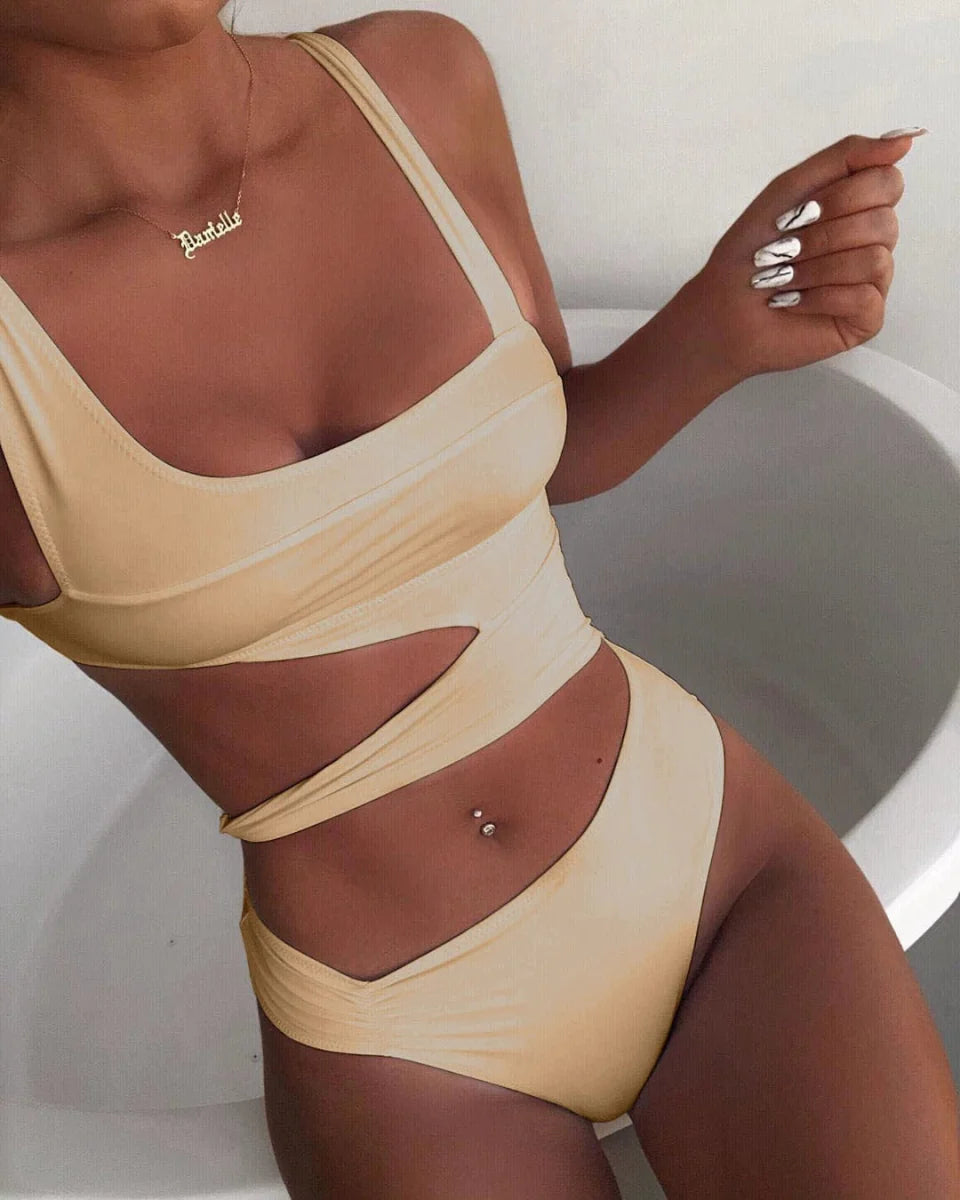 Showlu Fashion Store women's hollow-out one-piece swimsuit with triangle nylon chest pad, spaghetti straps, and solid color design.