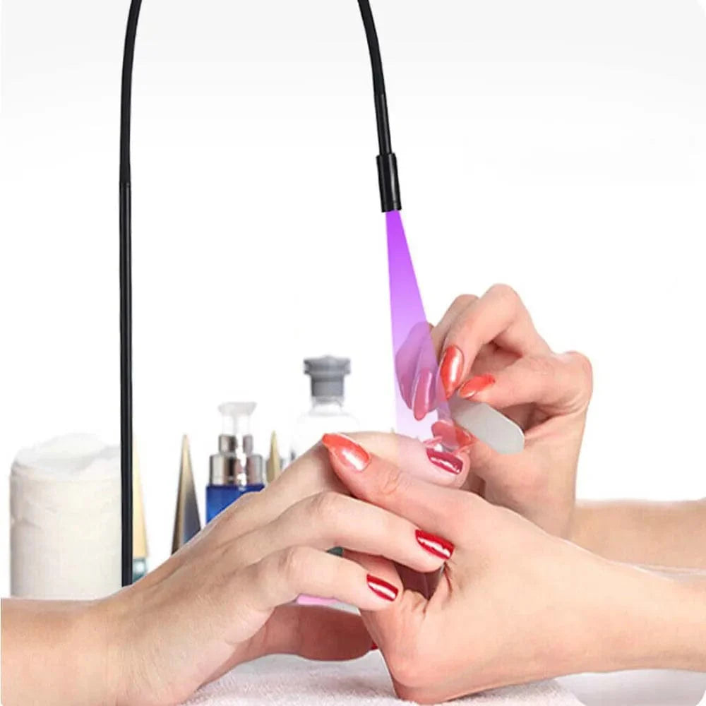 Vusum 5W UV LED glue curing floor lamp used for eyelash extensions and manicures, featuring a foot switch and ultraviolet light.