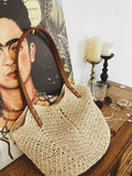 Straw shoulder bag by Showlu Fashion Store featuring woven pillow design, perfect for vacation and seaside outings.