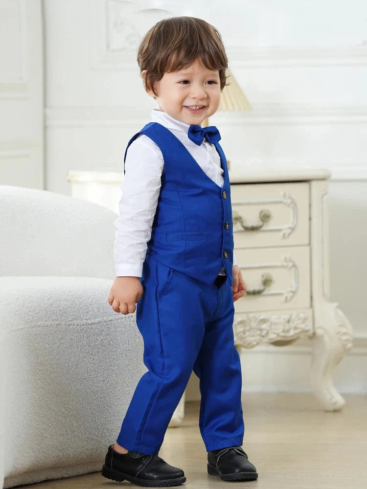 Navy blue boys' tuxedo suit with vest, bowtie, shirt, and pants, designed for a wedding or formal occasion, by Showlu Fashion.
