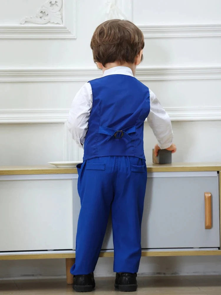 Boy's navy blue tuxedo suit with vest, bowtie, and shirt for wedding or formal occasions, stylish gentleman attire for boys.