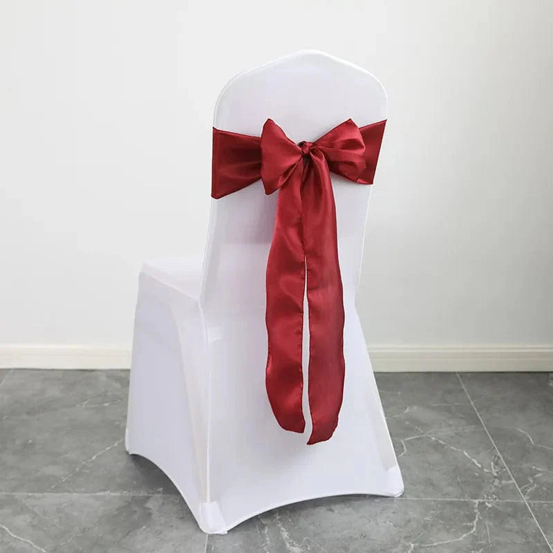 Shiny satin wedding chair sash by EVENTSDECOR, with elegant bow design, 15x275cm, ideal for luxury wedding and event decor.