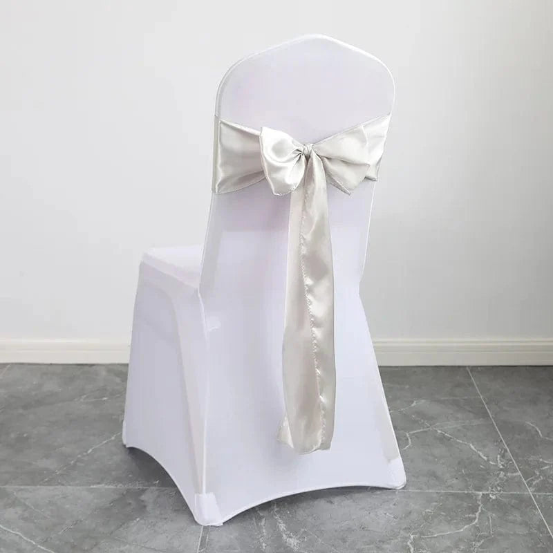 Shiny satin wedding chair sash with luxury bow design, 15x275cm, used for elegant wedding or event decoration.