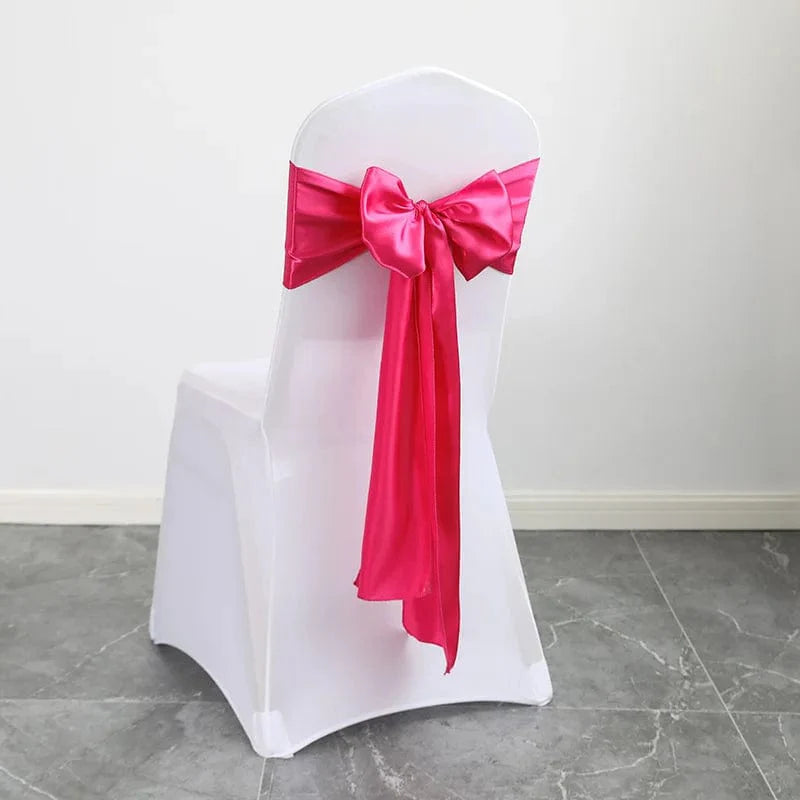 Shiny satin wedding chair sash with luxury bow design, 15x275cm, used for elegant wedding or party decor.