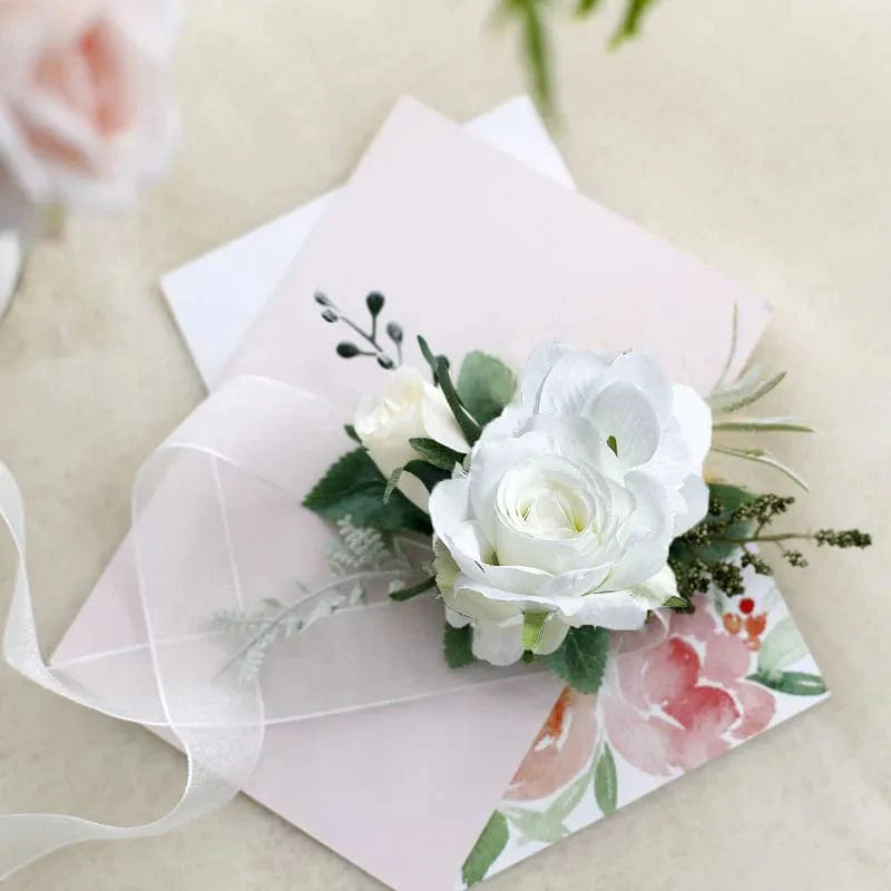 White artificial silk rose boutonniere and wrist corsage with red roses, ideal for weddings, bridesmaids, and formal occasions.