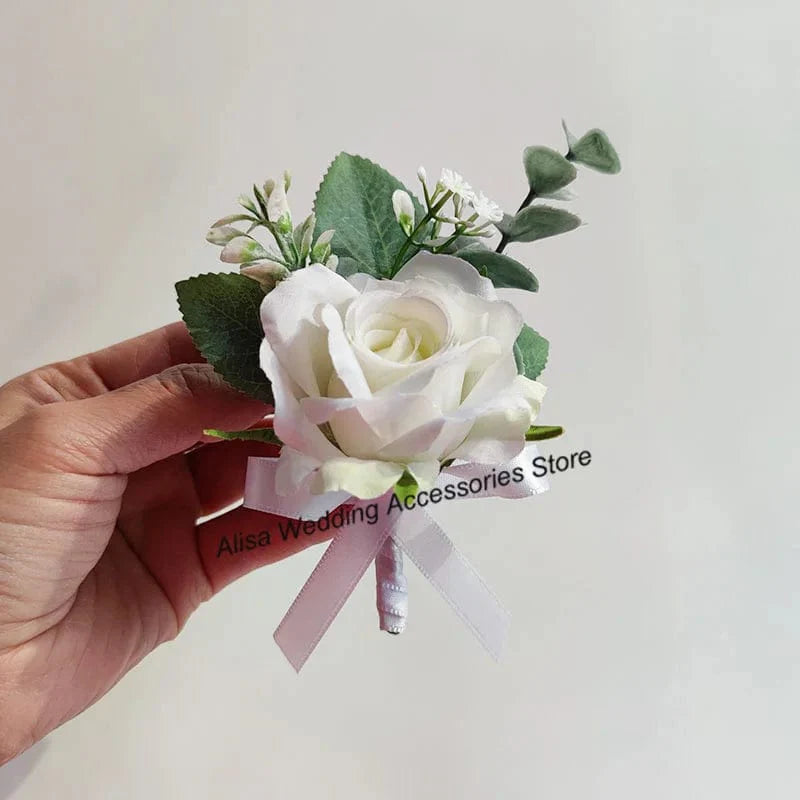 Artificial white silk rose wedding boutonniere and wrist corsage with red rose, suitable for bridesmaids, grooms, and guests.