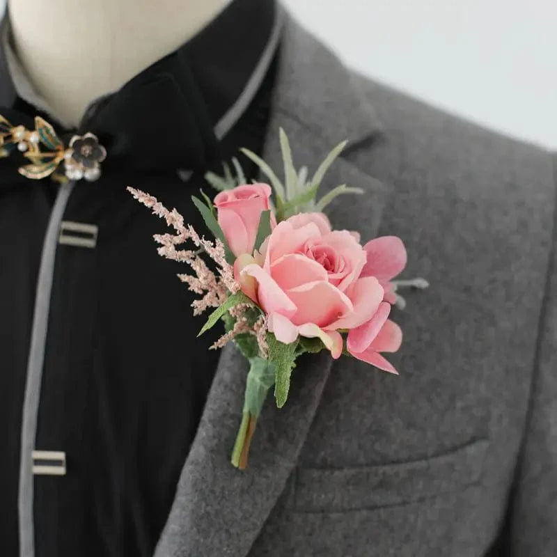 White artificial silk rose boutonniere and wrist corsage with red rose accents, ideal for wedding bridesmaids, grooms, and guests.