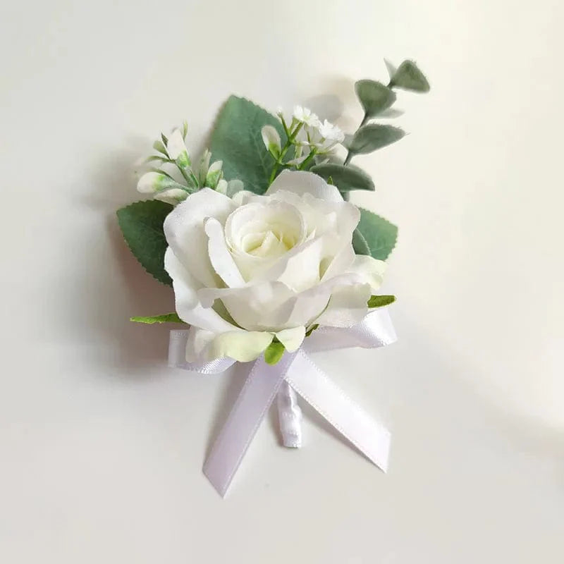 White artificial silk rose wedding boutonniere and wrist corsage with red rose, suitable for bridesmaids, grooms, and guests.