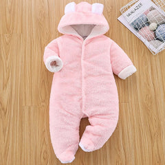 A pink, long-sleeved, hooded baby romper with bear ears and footies.