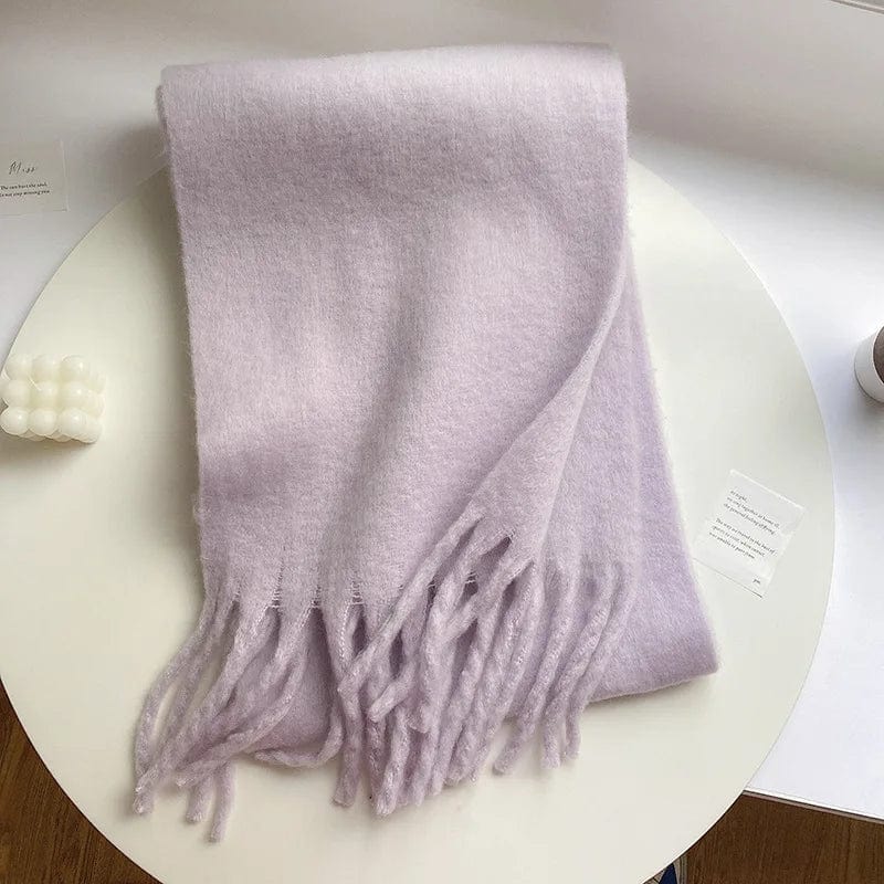Luxury women's cashmere winter scarf with thick, warm design, soft solid color, tasseled edges, and cozy shawl style.