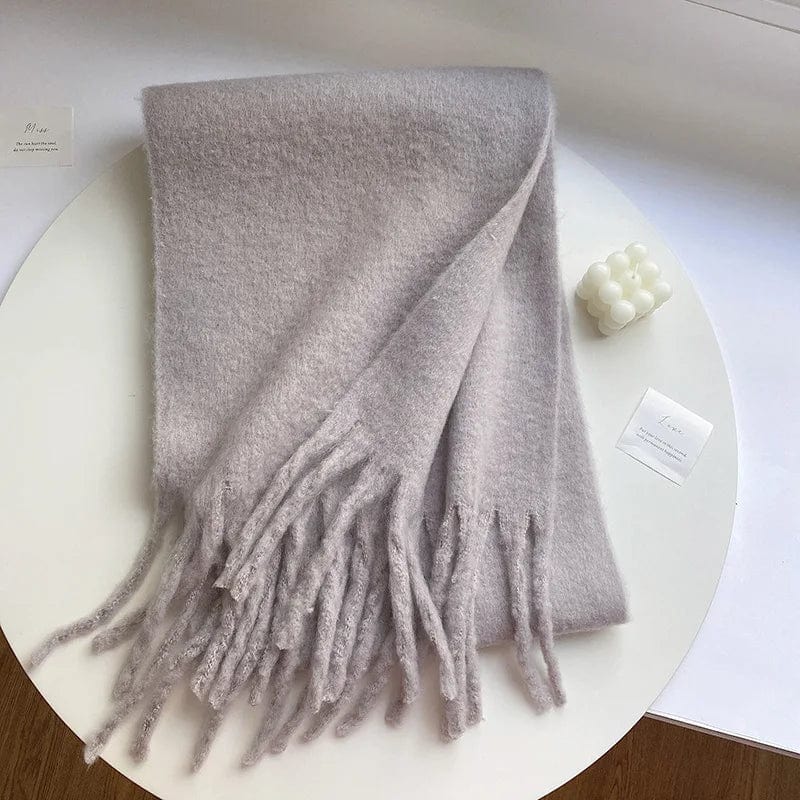 Luxury women's cashmere winter scarf with tassels, thick and warm, soft solid-color shawl for stylish cold-weather wear.