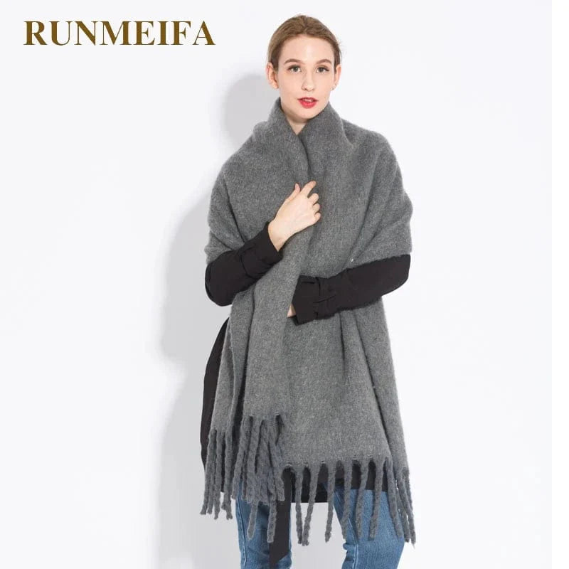 Luxury women's cashmere winter scarf with tassels, thick and soft, perfect for warmth and style during cold seasons.