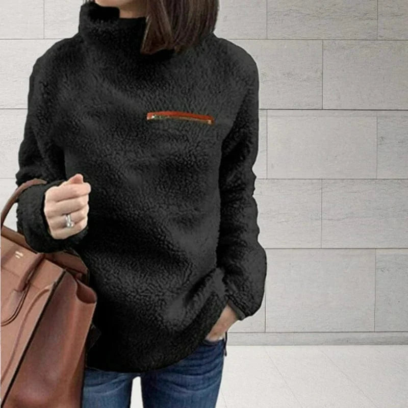 Slim fit women's turtleneck sweater by Showlu Fashion, featuring a zipper and soft, solid-colored fabric for a cozy winter look.