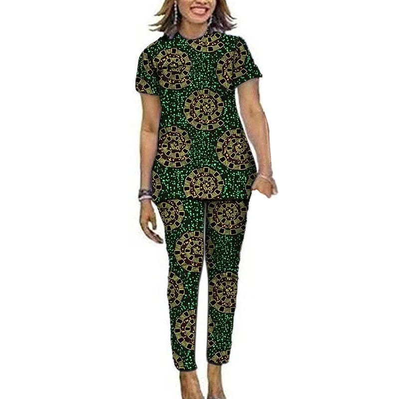Women wearing Showlu Fashion Ankara African print top and pants set, featuring short sleeves and vibrant Nigerian-inspired patterns.