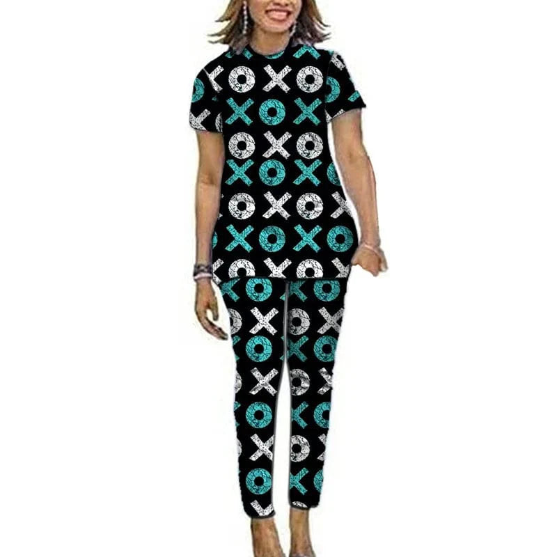 Women’s Ankara African print top and pants set by Showlu Fashion, featuring short sleeves and vibrant Nigerian-inspired patterns.