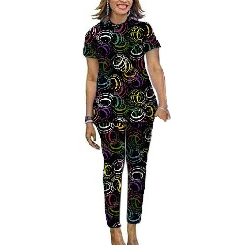 Women’s Ankara African print top and pants set by Showlu Fashion, featuring short sleeves and vibrant Nigerian-inspired patterns.