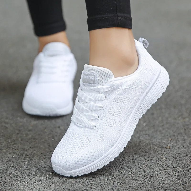 White women's breathable mesh walking sneakers with flat laces and vulcanized sole, ideal for casual and gym wear.
