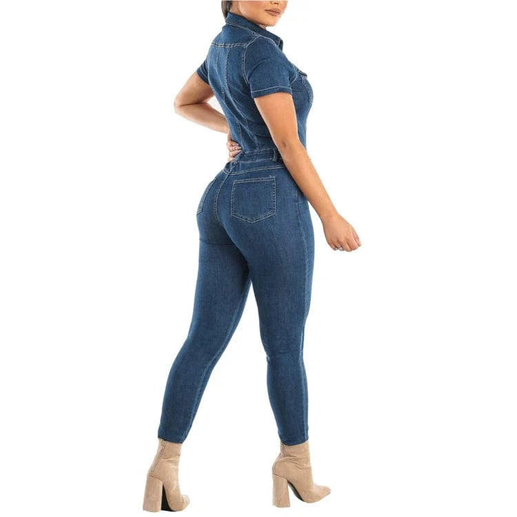 Women wearing Showlu Fashion denim bodycon jumpsuit with high waist and sash, featuring a fitted pencil style romper.