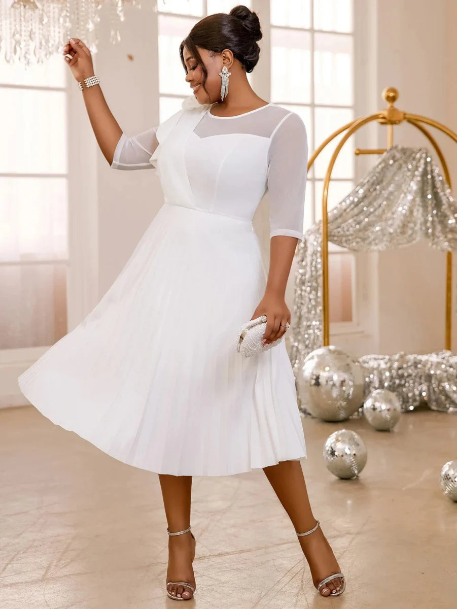 Elegant white pleated tulle dress for women, featuring ruffle details and high waist, perfect for wedding guests and evening events.