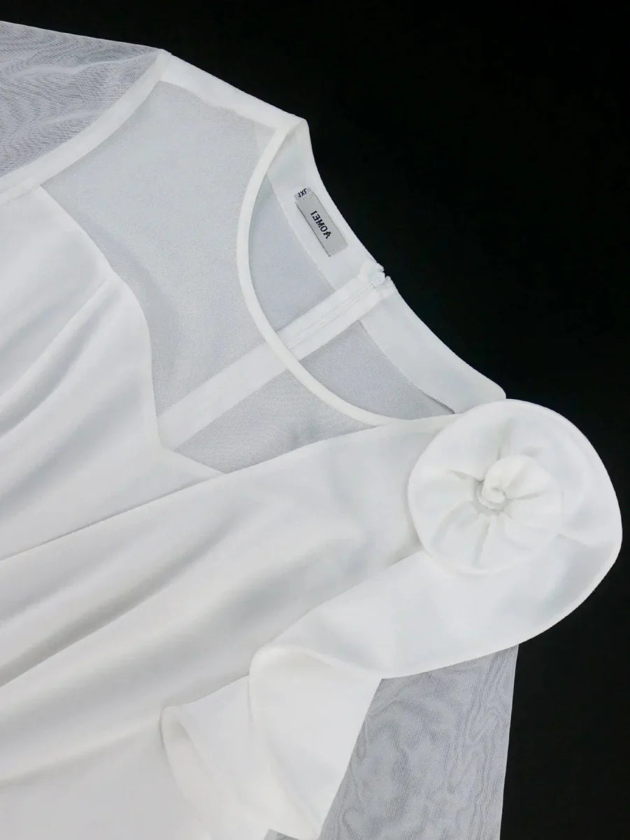Elegant white A-line tulle dress for women with pleats, ruffle details, and half-sleeves, ideal for wedding guests and evening events.