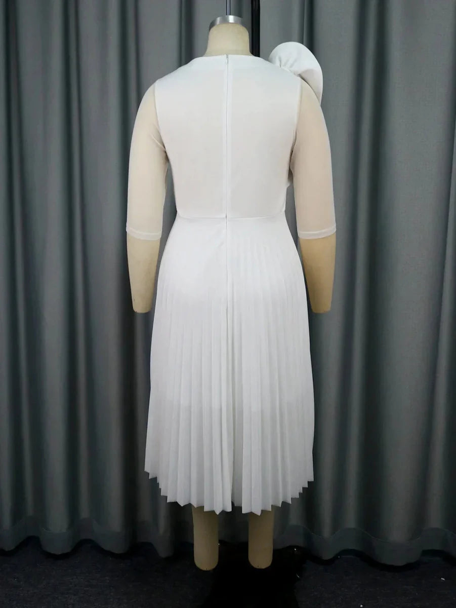 Elegant white pleated tulle dress for women, featuring ruffle details and high waist, perfect for weddings and evening events.