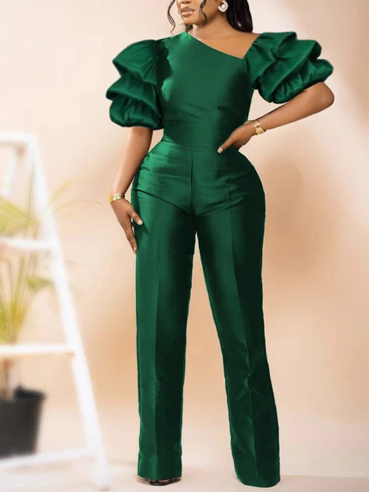 A woman wearing a shiny AOMEI women's jumpsuit with a skew collar, puff sleeves, high waist, and slim fit for summer or office wear.