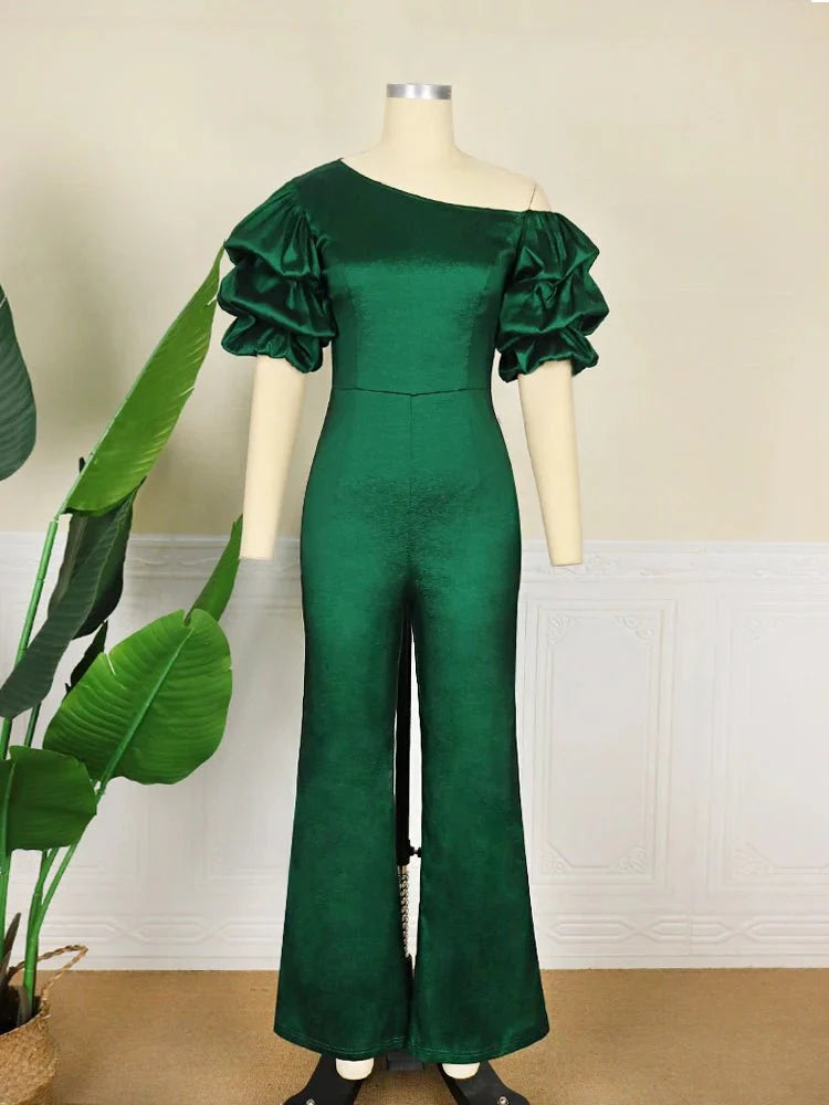 A woman wearing a shiny AOMEI women's jumpsuit with a skew collar, puff sleeves, high waist, and slim fit for summer or office wear.