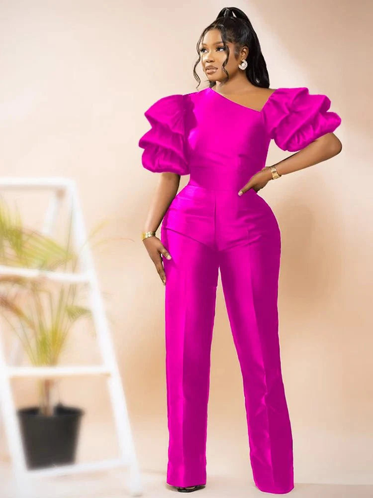 A woman wearing a shiny AOMEI women's jumpsuit with a skew collar, puff sleeves, high waist, and slim fit for summer fashion.