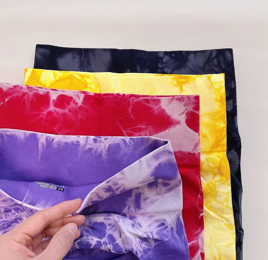 Women wearing Caeruleus Women's Tie-Dye Seamless Gym Leggings, high waist yoga pants with push-up, scrunch, and fitness features.