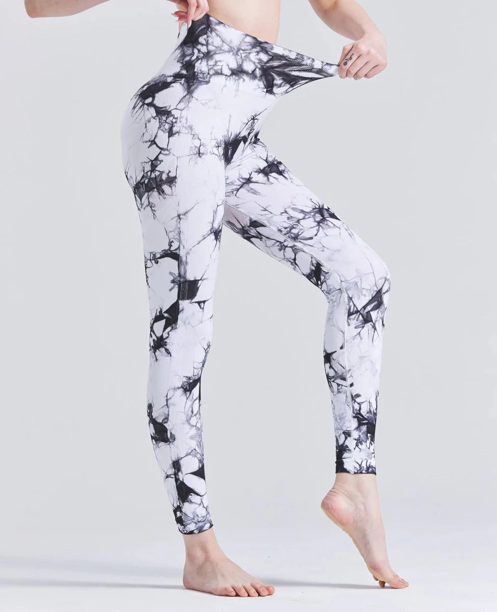 Women wearing Caeruleus Women's Tie-Dye Seamless Gym Leggings, high waist yoga pants with scrunch and push-up design for fitness.