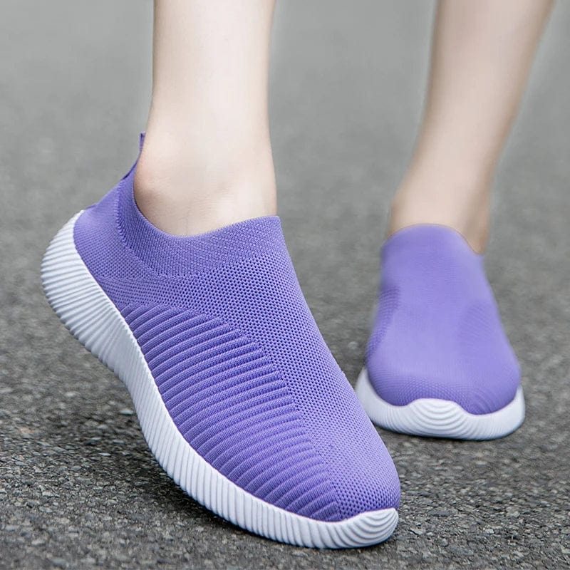 Showlu Fashion Women's slip-on vulcanized sneakers in cotton fabric, casual walking flats with a sleek, high-quality design.