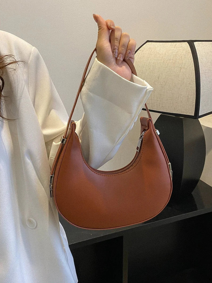 Women's PU leather saddle bag by SHOWLU FASHION STORE, Korean style shoulder satchel with sleek design and adjustable strap.