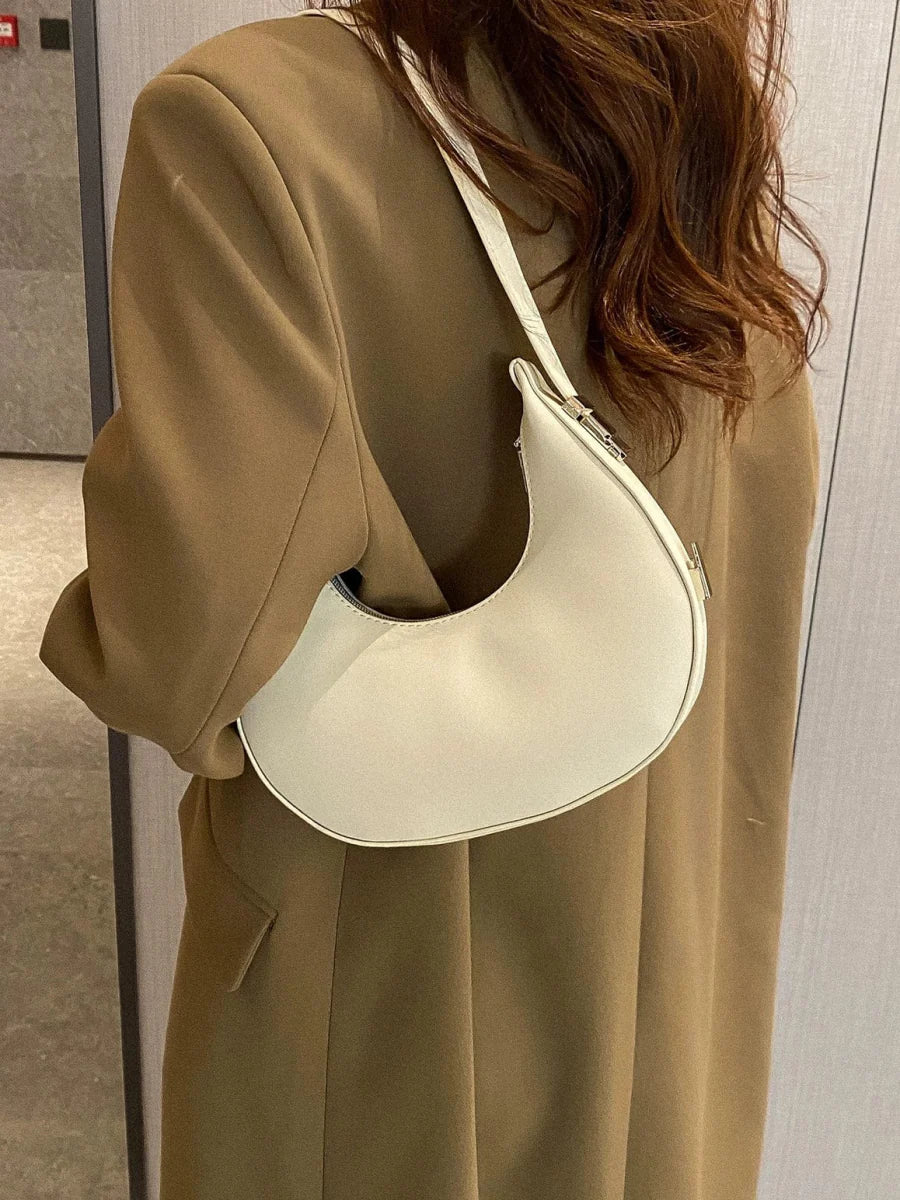 Women's PU leather saddle bag by SHOWLU FASHION STORE featuring a Korean-style shoulder satchel with a sleek, modern design.