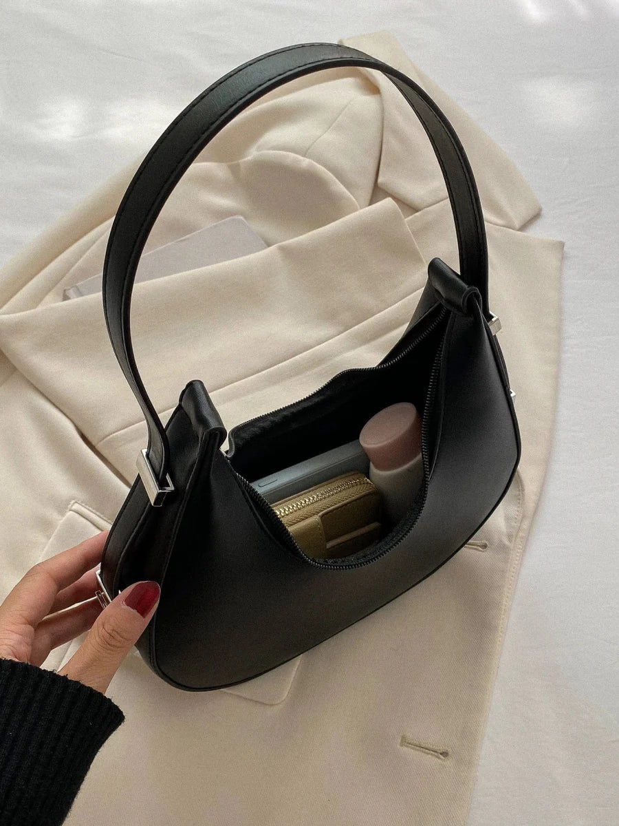 Women's PU leather saddle bag by SHOWLU FASHION, Korean-style shoulder satchel with sleek design and compact size.