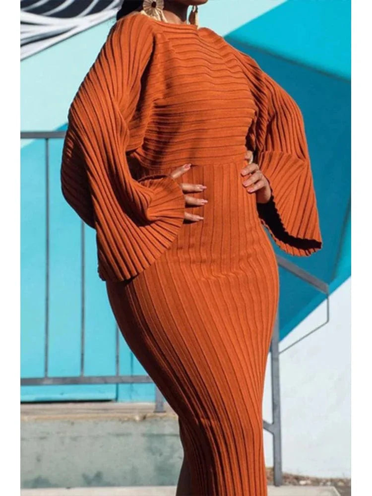 Women's QINGSHUJI batwing sleeve knitted rib bodycon midi dress with a round neck, stylish and elegant for autumn fashion.